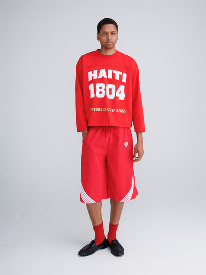 Haiti '26 Tee — Amends of the Heart, worn oversized on female model, black and white photographic multi-location print